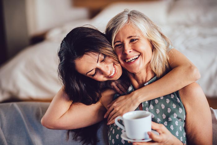 About 2 smiling mother and daughter